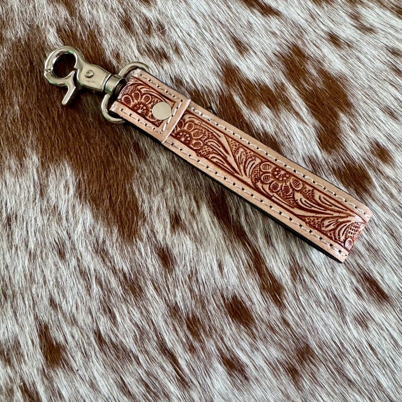 Sassy Western hand-tooled leather and cowhide keychain detail