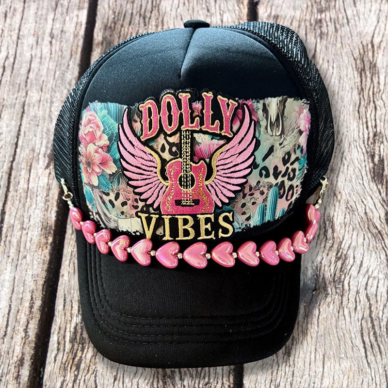 On A Whim Hats Dolly Vibes Trucker Hat - Black with Winged Guitar & Pink Heart Chain