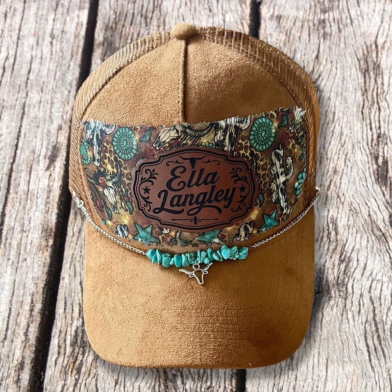 Handmade vegan suede western trucker hat with turquoise stone accents, patterned band, and star chain by On A Whim Hats