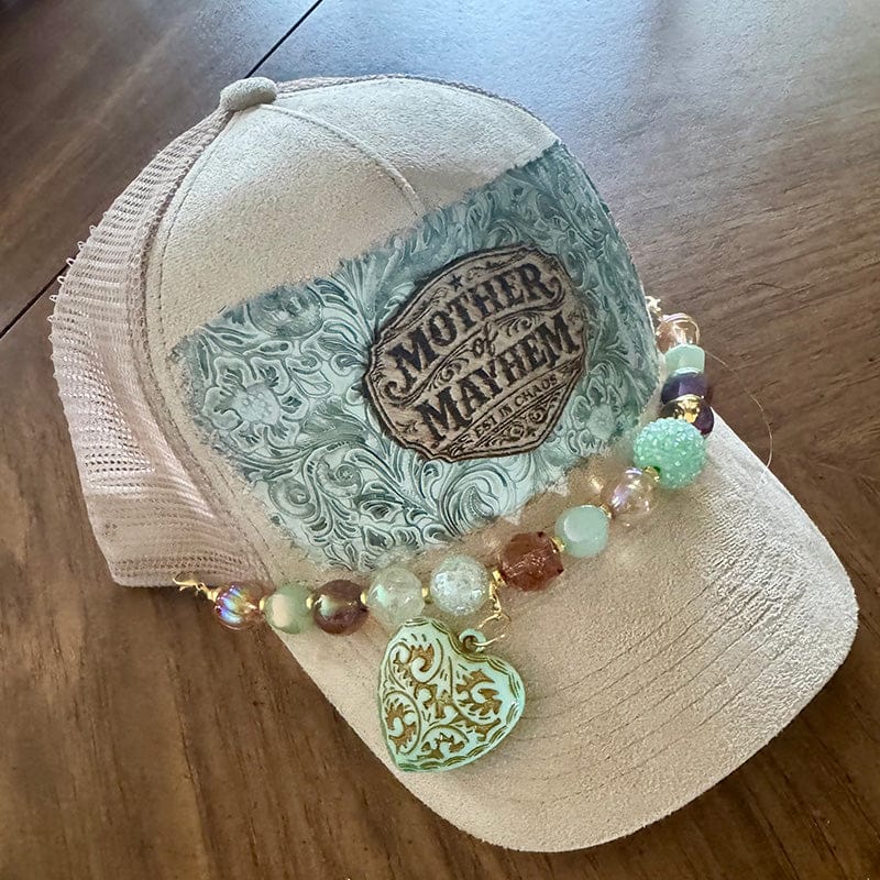 On A Whim Hats Mother of Mayhem Trucker Hat - Cream Suede with Tooled Floral & Beaded Heart Chain