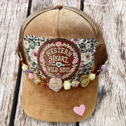 Camel suede western trucker hat with Western Heart Wild Soul leather patch and amber bead chain by On A Whim Hats