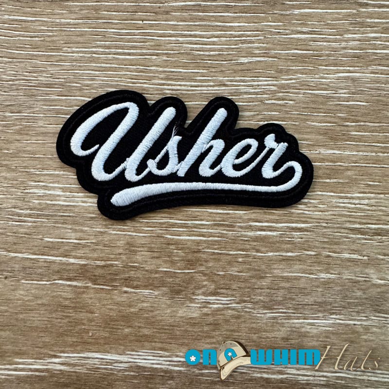 On A Whim Hats Usher Iron-On Patch